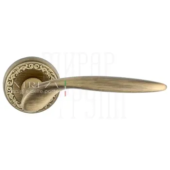 Дверная ручка Extreza 'Calipso' (Калипсо) 311 на круглой розетке R06 матовая бронза