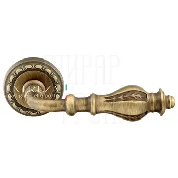 Дверная ручка Extreza 'Evita' (Эвита) 301 на круглой розетке R02 матовая бронза