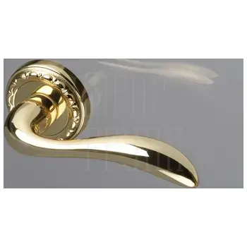 Дверная ручка Extreza 'FLEXA' (Флекса) 335 на круглой розетке R02 латунь