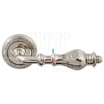 Дверная ручка Extreza 'Evita' (Эвита) 301 на круглой розетке R06 полированный никель