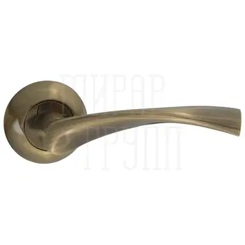 Дверные ручки Puerto (Пуэрто) INAL 506-08 на круглой розетке античная бронза