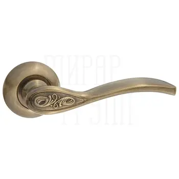 Дверные ручки Puerto (Пуэрто) INAL 516-08 на круглой розетке античная бронза