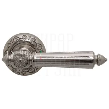 Дверная ручка Extreza 'Leon' (Леон) 303 на круглой розетке R04 полированный никель