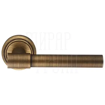 Дверная ручка Extreza 'NUVO' (Нуво) 125 на круглой розетке R01 матовая бронза
