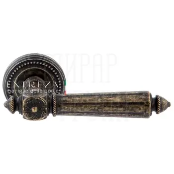 Дверная ручка Extreza 'Leon' (Леон) 303 на круглой розетке R03 античная бронза
