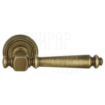 Дверная ручка Extreza 'Veronika' (Вероника) 325 на круглой розетке R03 матовая бронза