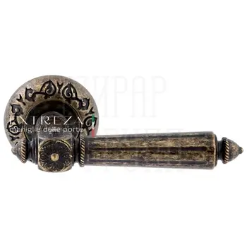 Дверная ручка Extreza 'Leon' (Леон) 303 на круглой розетке R04 античная бронза