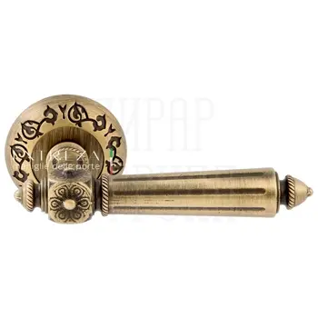 Дверная ручка Extreza 'Leon' (Леон) 303 на круглой розетке R04 матовая бронза