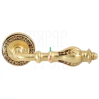 Дверная ручка Extreza 'Evita' (Эвита) 301 на круглой розетке R06 французское золото