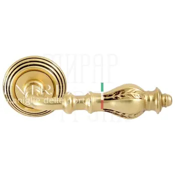 Дверная ручка Extreza 'Evita' (Эвита) 301 на круглой розетке R05 французское золото