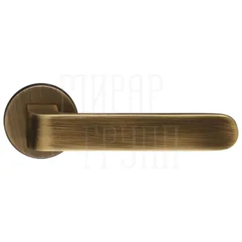 Дверная ручка Extreza Hi-tech 'RUBI' (Руби) 121 на круглой розетке R16 матовая бронза