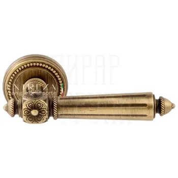 Дверная ручка Extreza 'Leon' (Леон) 303 на круглой розетке R03 матовая бронза