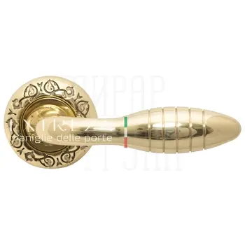 Дверная ручка Extreza 'Mirel' (Мирел) 316 на круглой розетке R04 полированная латунь