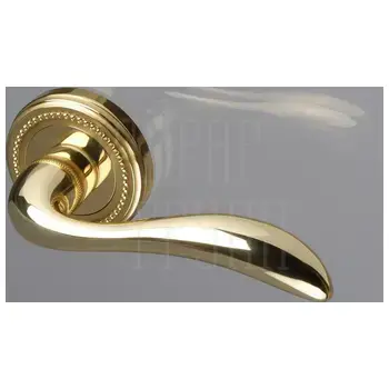 Дверная ручка Extreza 'FLEXA' (Флекса) 335 на круглой розетке R03 латунь