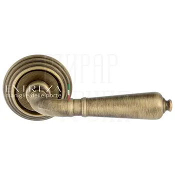 Дверная ручка Extreza 'Petra' (Петра) 304 на круглой розетке R05 матовая бронза