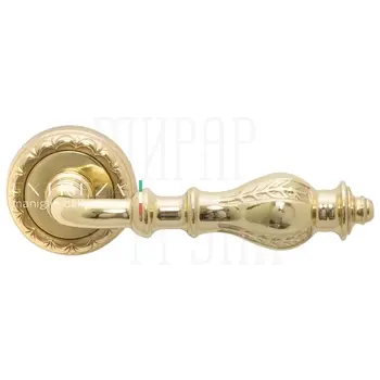 Дверная ручка Extreza 'Evita' (Эвита) 301 на круглой розетке R02 полированная латунь