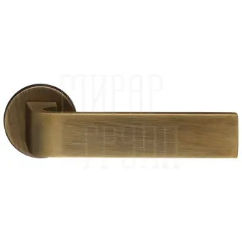 Дверная ручка Extreza Hi-Tech 'Sound' (Саунд) 106 на круглой розетке R16 матовая бронза