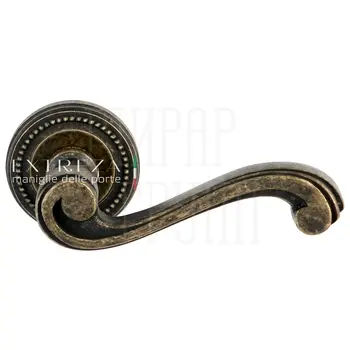 Дверная ручка Extreza 'Lina' (Лина) 313 на круглой розетке R03 античная бронза
