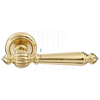 Дверная ручка Extreza 'DANIEL' (Даниел) 308 на круглой розетке R01 полированное золото