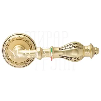 Дверная ручка Extreza 'Evita' (Эвита) 301 на круглой розетке R02 французское золото