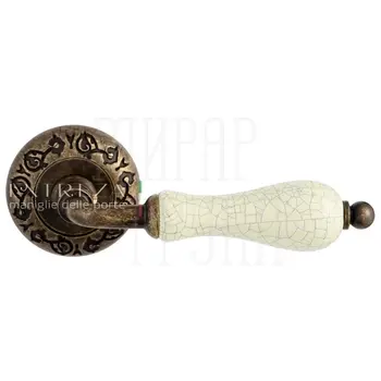 Дверная ручка Extreza 'Dana' CRACKLE (Дана кракле) 306 на круглой розетке R04 античная бронза